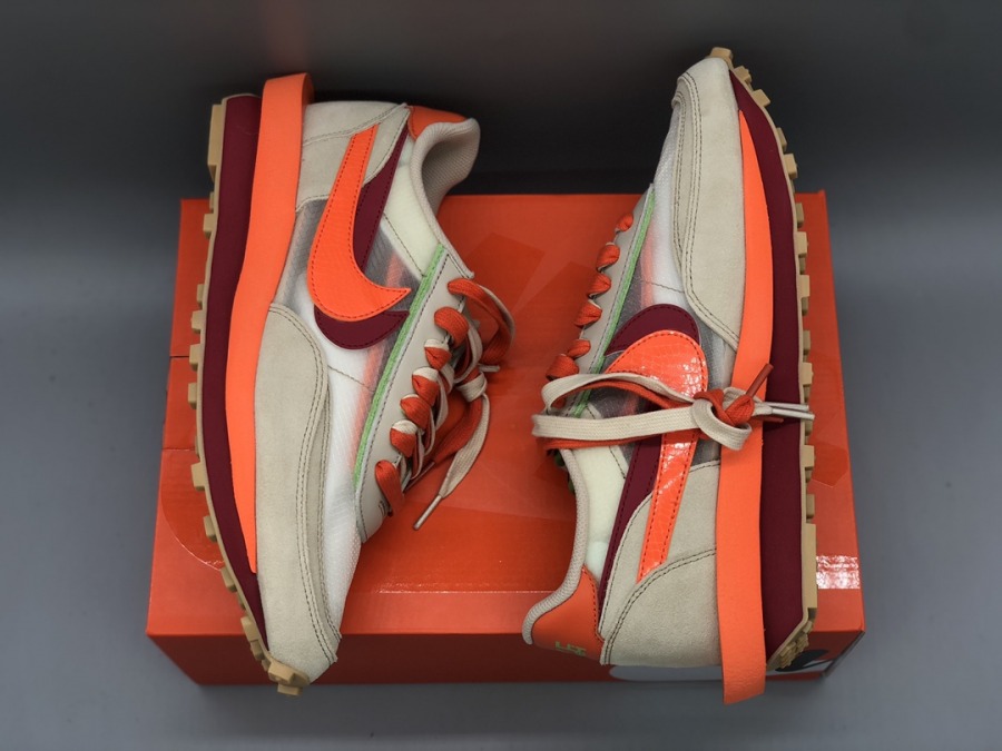 sacai clot net orange blaze on feet